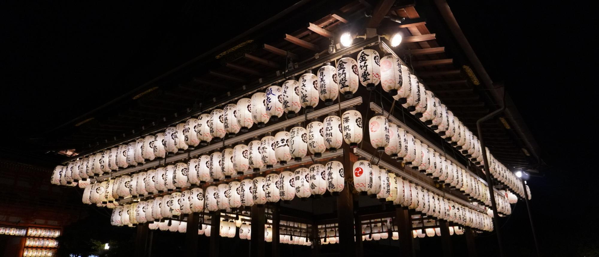 Illuminated paper lanterns on a festival float at night, Japan